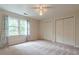 Bedroom with ceiling fan and double closets at 3420 Forest Valley Way, Cumming, GA 30041