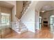 Two-story foyer with hardwood floors and staircase at 3420 Forest Valley Way, Cumming, GA 30041