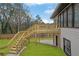 Elevated deck with stairs leading to a fenced backyard at 5080 N Redan Cir, Stone Mountain, GA 30088