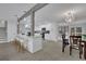 Modern kitchen with white cabinets and island open to dining area at 5080 N Redan Cir, Stone Mountain, GA 30088