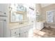 Elegant bathroom with double vanity, tile flooring and large mirrors at 7905 Fawndale Way, Atlanta, GA 30350