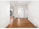 Bright entryway with hardwood floors and white wainscoting at 7905 Fawndale Way, Atlanta, GA 30350