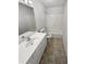 Clean bathroom with white vanity and bathtub at 3714 Thunder Ne Way, Marietta, GA 30066