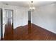 Well-lit bedroom with hardwood floors and neutral walls at 3714 Thunder Ne Way, Marietta, GA 30066