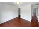 Spacious bedroom with hardwood floors and access to hallway at 3714 Thunder Ne Way, Marietta, GA 30066