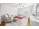 Cozy bedroom with hardwood floors, a plush rug, and ample natural light at 1143 Wonder Ln, Marietta, GA 30062