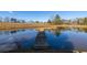 Long wooden dock stretching across a tranquil pond at 7108 Villa Rica Hwy, Dallas, GA 30157