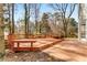 Large deck with multiple seating areas and treetop views at 242 Ivy Glen Cir, Avondale Estates, GA 30002