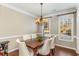 Formal dining room with hardwood floors and chandelier at 242 Ivy Glen Cir, Avondale Estates, GA 30002