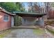 Detached carport with block walls and gravel flooring at 3953 Rhyne Se Way, Smyrna, GA 30082