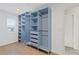 Spacious walk-in closet with light blue shelving and drawers at 2007 Hamilton Lake Ct, Buford, GA 30519