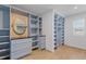 Large walk-in closet with ample shelving and drawers at 2007 Hamilton Lake Ct, Buford, GA 30519