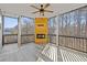 Screened porch with fireplace and ceiling fan at 2007 Hamilton Lake Ct, Buford, GA 30519