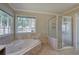 Large bathroom with corner jacuzzi tub and separate shower at 427 Picketts Lake Dr, Acworth, GA 30101