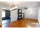 Bright dining room with hardwood floors, chandelier, and fireplace at 1863 Derrill Dr, Decatur, GA 30032