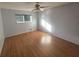 Bright bedroom featuring hardwood floors and a ceiling fan at 3850 Benchmark Dr, Atlanta, GA 30349