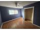 Spacious bedroom with hardwood floors and a ceiling fan at 3850 Benchmark Dr, Atlanta, GA 30349