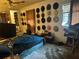 Bedroom with a double bed and many hats on the wall at 271 Andrew Hairston Nw, Atlanta, GA 30314