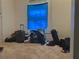 Room with packed luggage and clothing on the floor at 271 Andrew Hairston Nw, Atlanta, GA 30314