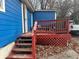 Wooden deck with red railings and surrounding foliage at 271 Andrew Hairston Nw, Atlanta, GA 30314