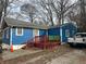 Blue house with wooden deck and truck parked nearby at 271 Andrew Hairston Nw, Atlanta, GA 30314