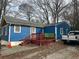 Blue house with wooden deck and truck parked nearby at 271 Andrew Hairston Nw, Atlanta, GA 30314