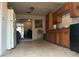 Galley kitchen with wood cabinets and tile floor at 271 Andrew Hairston Nw, Atlanta, GA 30314