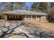 Brick ranch house with carport and mature trees at 1136 Powell Se Ct, Atlanta, GA 30316