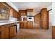 View of kitchen with wood cabinets and appliances at 1136 Powell Se Ct, Atlanta, GA 30316