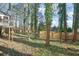 Wooded backyard with a privacy fence and mature trees at 3952 Fairington Dr, Marietta, GA 30066