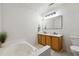 Bathroom with double vanity and garden tub at 5862 Homestead Cir, Rex, GA 30273