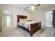 Main bedroom with large bed and access to bath at 5862 Homestead Cir, Rex, GA 30273