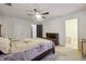Main bedroom with dresser and access to bath at 5862 Homestead Cir, Rex, GA 30273