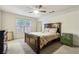 Main bedroom with a double bed and ceiling fan at 5862 Homestead Cir, Rex, GA 30273