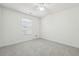 Simple bedroom with neutral walls and carpet flooring at 5862 Homestead Cir, Rex, GA 30273