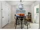 Charming dining area with a unique table and industrial-style stools at 5862 Homestead Cir, Rex, GA 30273