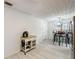 Bright dining area with a farmhouse-style table and convenient kitchen access at 5862 Homestead Cir, Rex, GA 30273