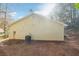 Rear view of a single story house with vinyl siding and a spacious backyard at 5862 Homestead Cir, Rex, GA 30273