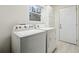 Functional laundry room with washer, dryer, and extra storage at 5862 Homestead Cir, Rex, GA 30273