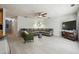 Spacious living room featuring a large sectional sofa and stylish decor at 5862 Homestead Cir, Rex, GA 30273