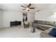 Bright living room with a comfortable seating arrangement and wood-look floors at 5862 Homestead Cir, Rex, GA 30273