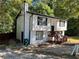 Two-story house with white siding, wood deck, and a partially visible driveway at 2290 Wilkins Cv, Decatur, GA 30035