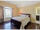 Bedroom with hardwood floors and en-suite bathroom at 1255 Mcminn Way, Snellville, GA 30078