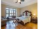 Bedroom with a large bed and hardwood floors at 1255 Mcminn Way, Snellville, GA 30078