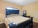 Spacious bedroom with large bed and dark wood furniture at 1255 Mcminn Way, Snellville, GA 30078
