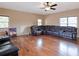 Bright bonus room featuring hardwood floors and a large sectional sofa at 1255 Mcminn Way, Snellville, GA 30078