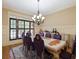Elegant dining room with ornate table and purple chairs at 1255 Mcminn Way, Snellville, GA 30078