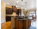 Gourmet kitchen with dark wood cabinetry and granite island at 1255 Mcminn Way, Snellville, GA 30078