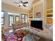 Living room with a fireplace, large TV, and comfortable seating at 1255 Mcminn Way, Snellville, GA 30078
