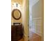 Elegant powder room with dark vanity, oval mirror, and wainscoting at 1255 Mcminn Way, Snellville, GA 30078